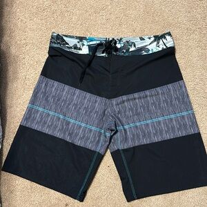 Men’s baiting suit. NWOT, bottle opener attached to back pocket! Size 36.